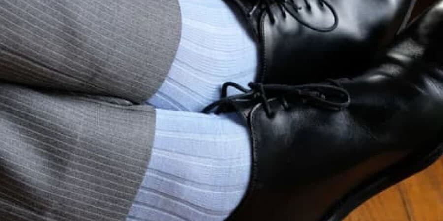 Plain Light Blue Socks On Black Shoes